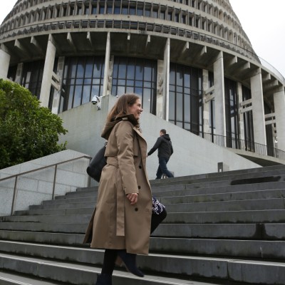 Woman walking up steps outside Beehive