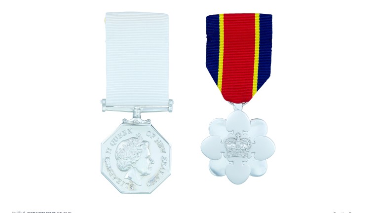 The full-size New Zealand Antarctic Medal on ribbon shown alongside the full-size New Zealand Distinguished Service Decoration on ribbon