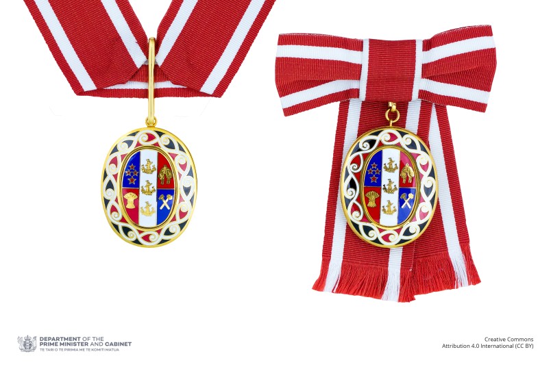 Badge of a Member of the Order of New Zealand (two badges shown side-by-side on neck ribbon and ribbon bow respectively)