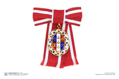 Badge of a Member of the Order of New Zealand (on ribbon bow)